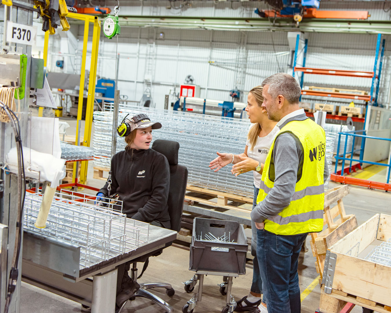 Workers in high-vis gear at facility
